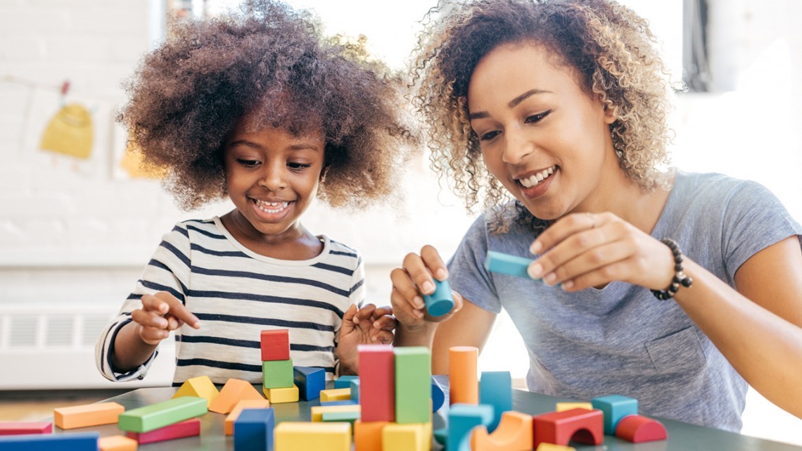 A child associate plays with a child.