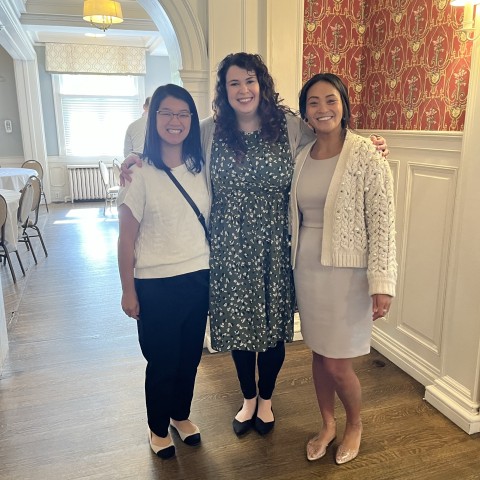 Staff members Sarah Boorsma, Sarah Bennett, and Charlotte Passero hug and smile!