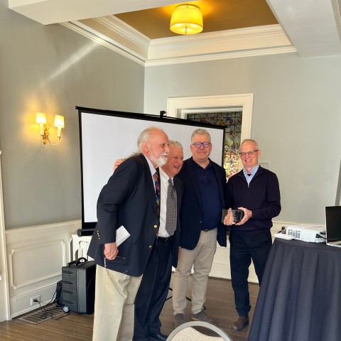 New Coterie member Dirk Hightower and his nominators hug.