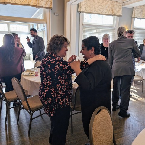 Newly initiated Coterie Winner Ida Perez and her nominator Dawn Breitung share a hug.
