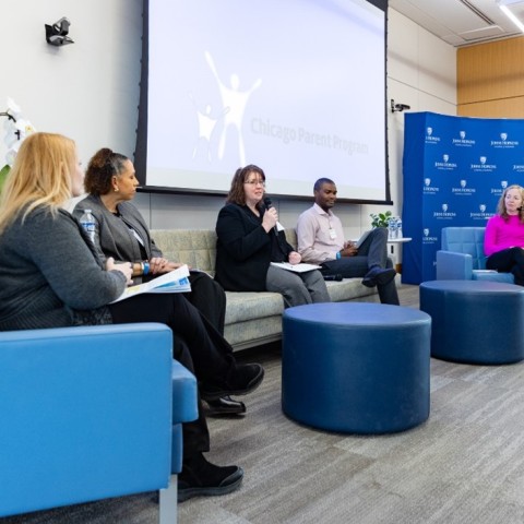 Group of people sitting in a room.