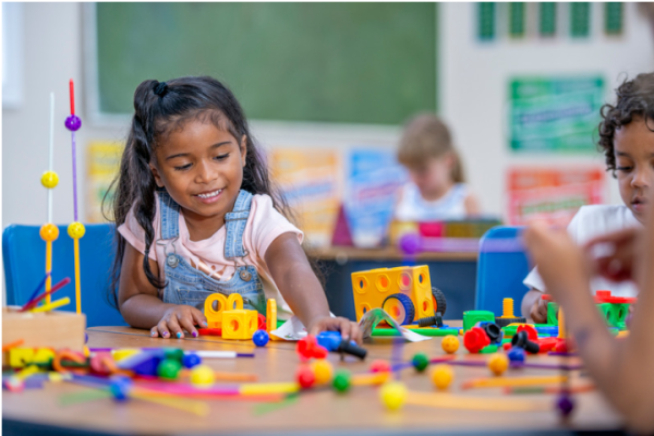 Kids play with blocks.